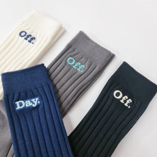 five pairs of socks with the words on them