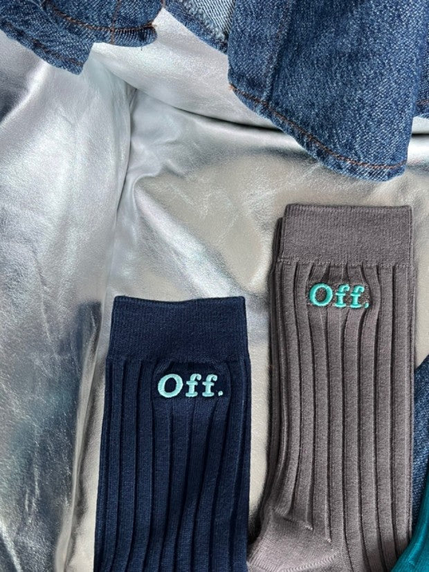 three pairs of socks with the word off on them