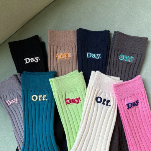 six pairs of socks with the words on them